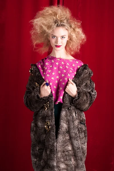 Beautiful blond woman in a fur — Stock Photo, Image