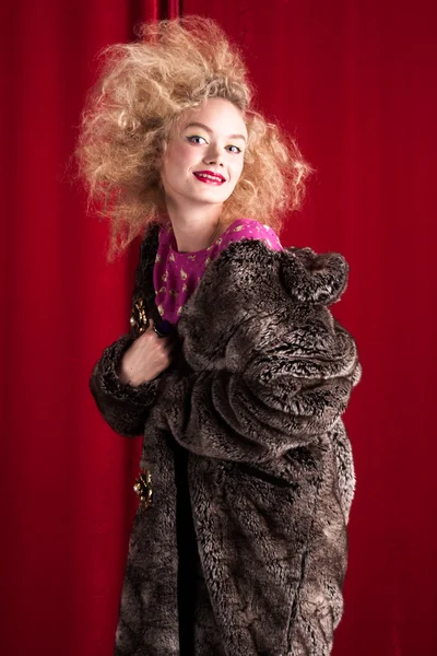 Beautiful blond woman in a fur — Stock Photo, Image