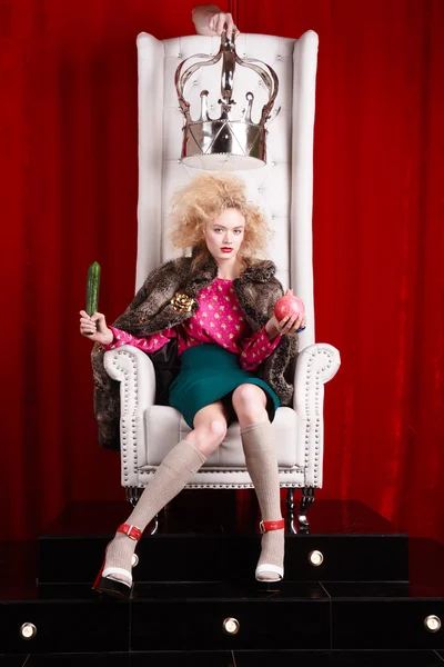 Princess woman in fur coat sitting on throne — Stock Photo, Image