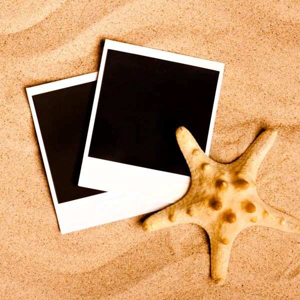 Instant photo frames on the beach — Stock Photo, Image