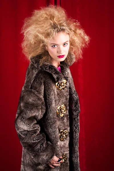 Beautiful blond woman in a fur — Stock Photo, Image