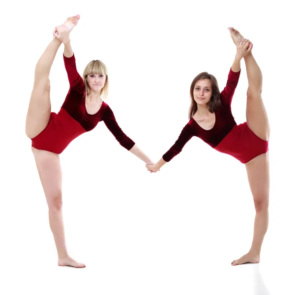 Duas mulheres dançam em um fundo branco — Fotografia de Stock