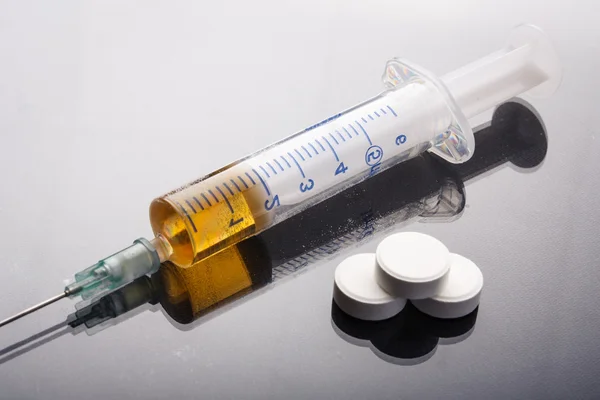 Drug syringe and cooked heroin — Stock Photo, Image