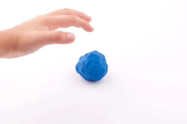 Plasticine and hand — Stock Photo, Image