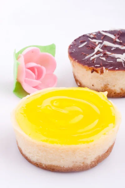 Mini chocolate, lemon and raspberry cheesecakes — Stock Photo, Image