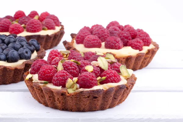 Raspberry and blueberry mini tarts — Stock Photo, Image
