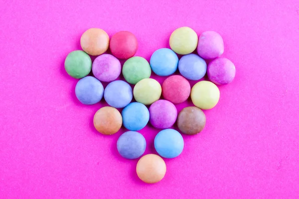 Sugar coated pills heart shape — Stock Photo, Image