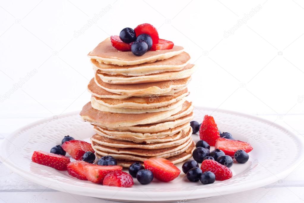 Stack of pancakes with strawberry and blueberry