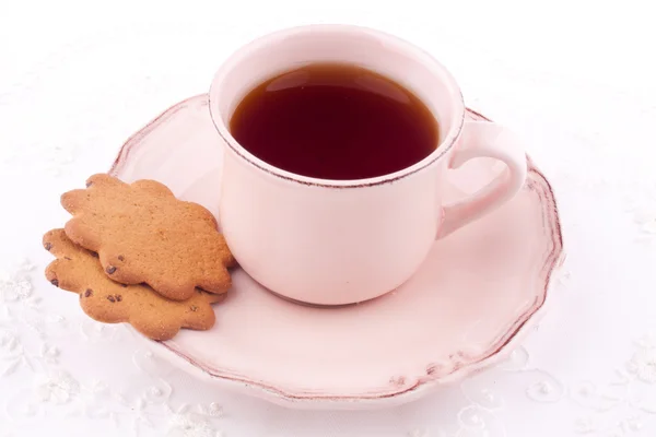 A cup of tea and thin biscuit — Stock Photo, Image