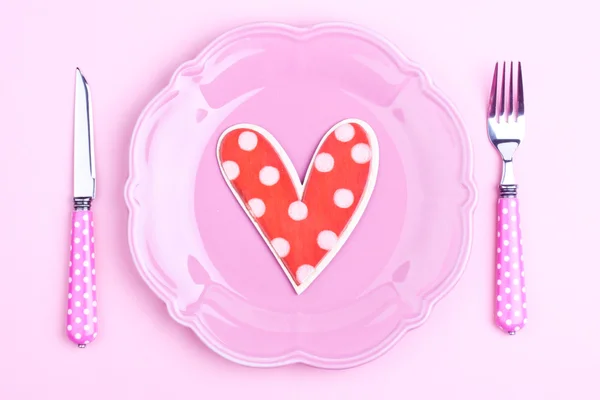 Heart on a pink plate Royalty Free Stock Images