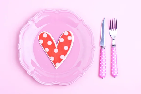 Heart on a pink plate Stock Picture