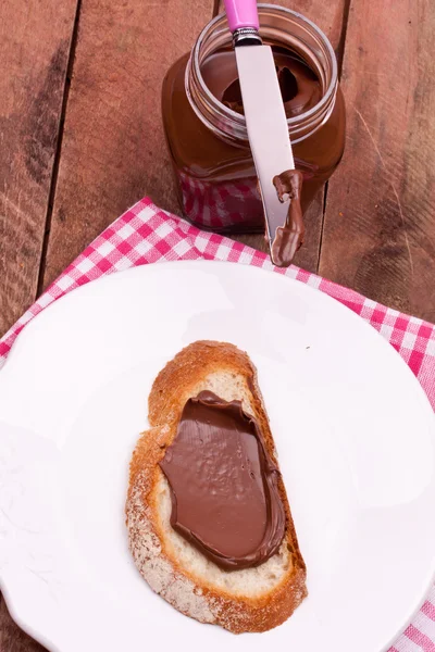 Chocolate cream and bread — Stock Photo, Image