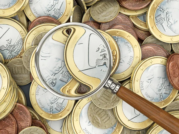 Euro coins with magnifying glass — Stock Photo, Image