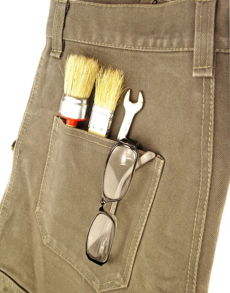 Working tools in the back pocket of jeans — Stock Photo, Image