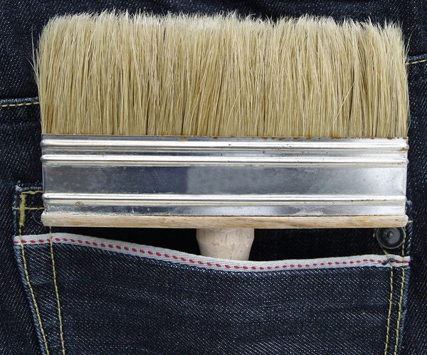 The brush inside the jeans pocket. — Stock Photo, Image