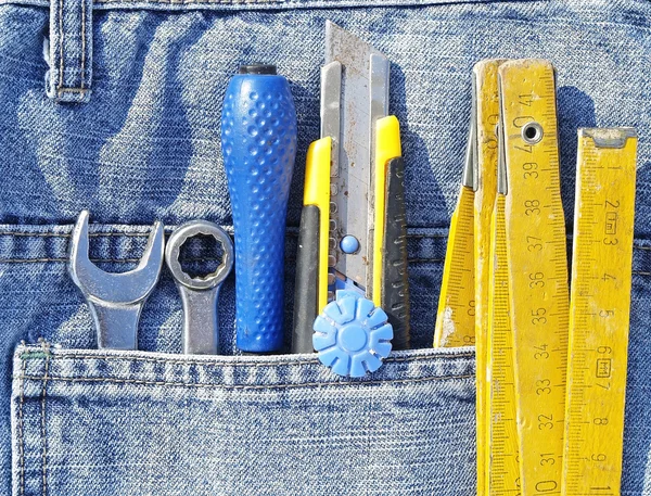 Tools and jeans pocket — Stock Photo, Image