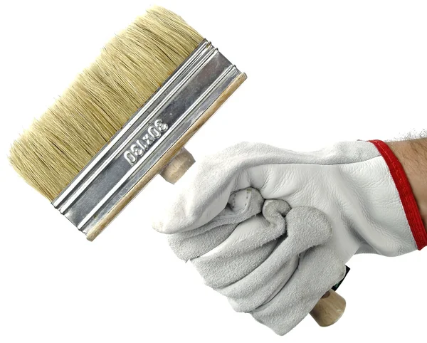 Gloved hand with brush — Stock Photo, Image