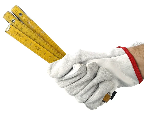 A hand with a yard stick — Stock Photo, Image