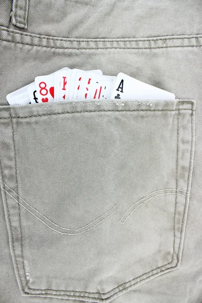 Closeup to jeans pocket with game cards — Stock Photo, Image