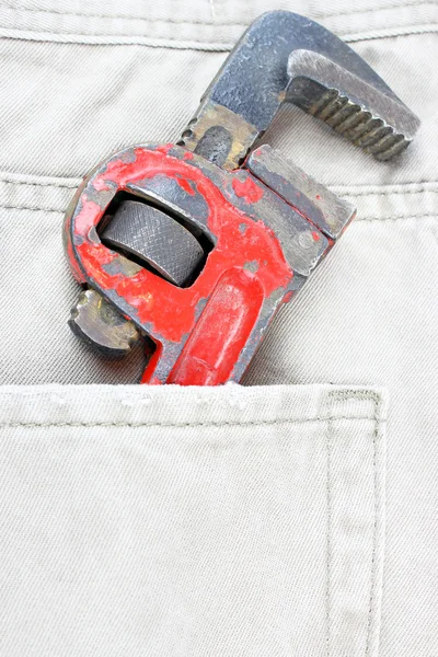 Jeans pocket with spanner — Stock Photo, Image