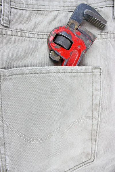 Jeans pocket with spanner — Stock Photo, Image