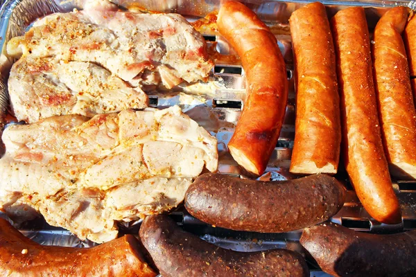 The sausage, wings and the pork neck on grilu — Stock Photo, Image