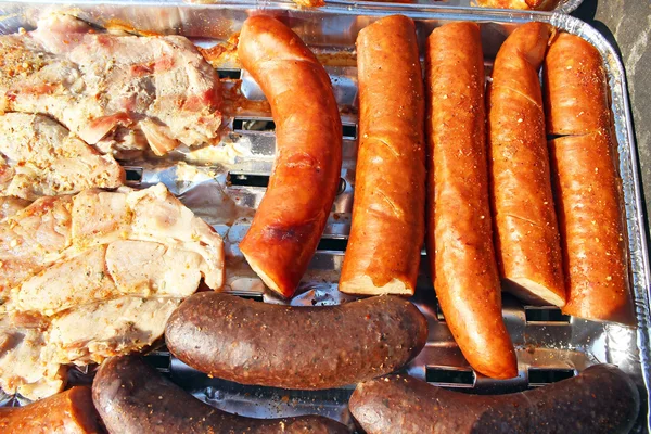 The sausage, wings and the pork neck on grilu — Stock Photo, Image