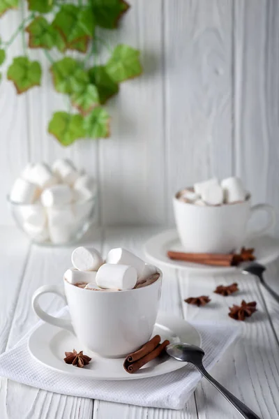 Mug with hot chocolate and marshmallows on wooden table — Stock Photo, Image