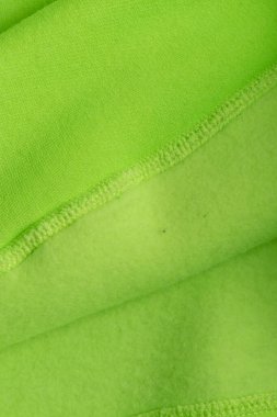 Kapüşonlu kumaş. Kapüşonlu kapüşonlu, kahverengi, tekstil, sıcak kumaş, makro arka plan. Yeşil renk