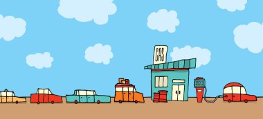 Benzin istasyonunda bekleyen arabalar.