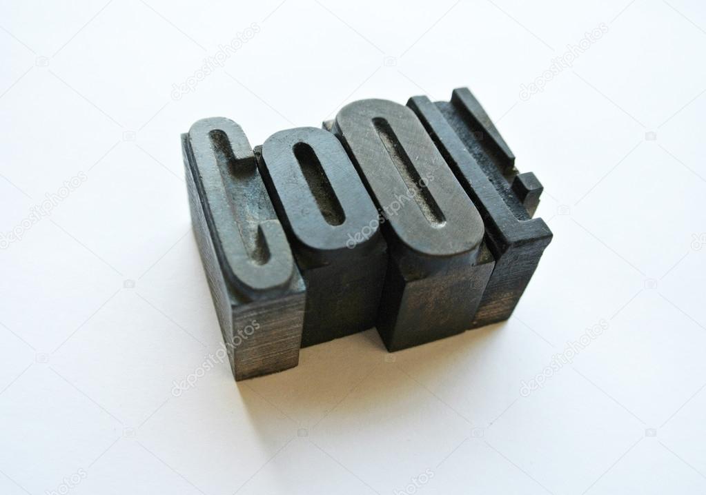 Woodtype letters forming a cool word