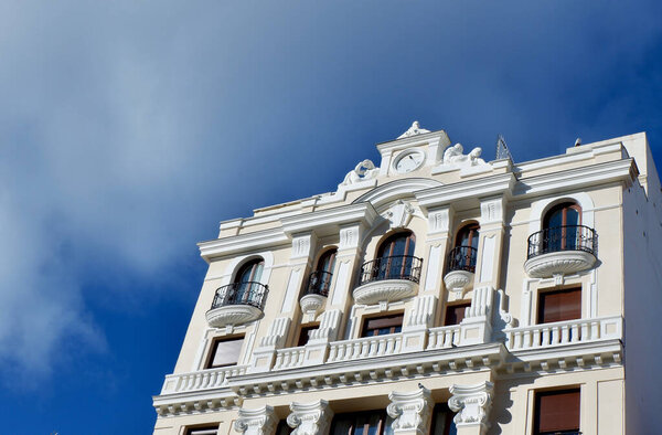 Beige exterior of classic renaissance building in Madrid, Spain.