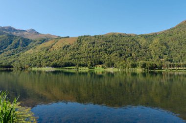 Calm mountain lake in the tourist area in Saint Lary village, Saint-Lary, Midi Pyrenees, France.