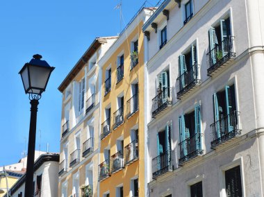 Old buildings of faded colours in Tirso de Molina, central district of Madrid, Spain.