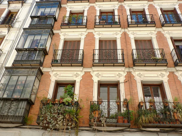 Old fashioned facade of the vintage building in Malasana district downtown Madrid, Spain.