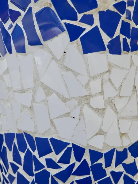 Colourful mosaic of broken tiles in blue and white colours. Photo for backdrop and background.