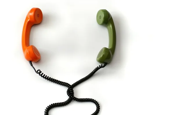 Beyaz arka plan üzerinde izole iki telefon ahizesi