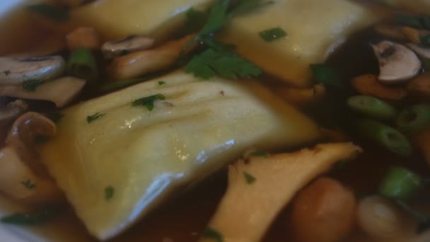 Mushroom soup with filled pasta square — Stock Video