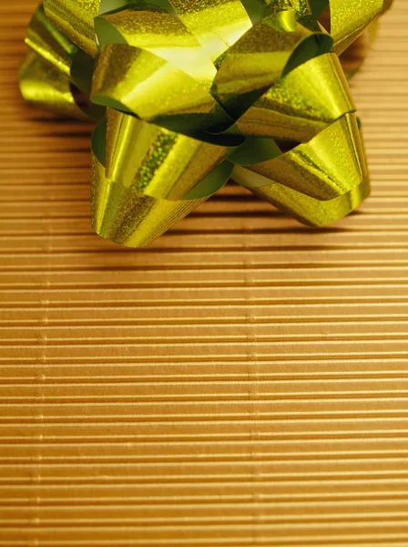 Holiday gift in green and gold — Stock Photo, Image
