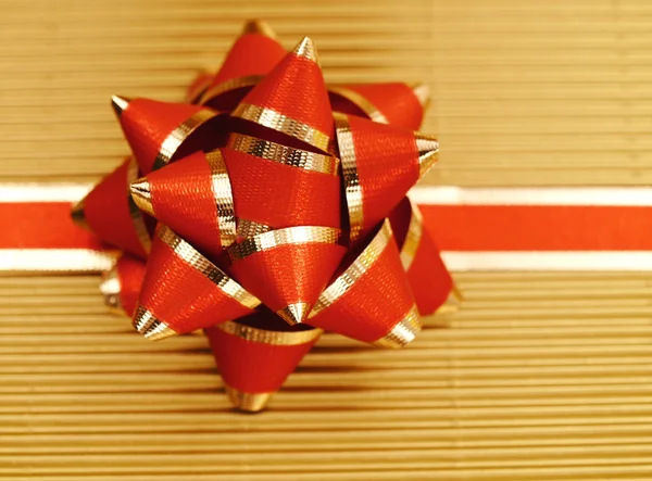 Holiday gift in red and gold — Stock Photo, Image