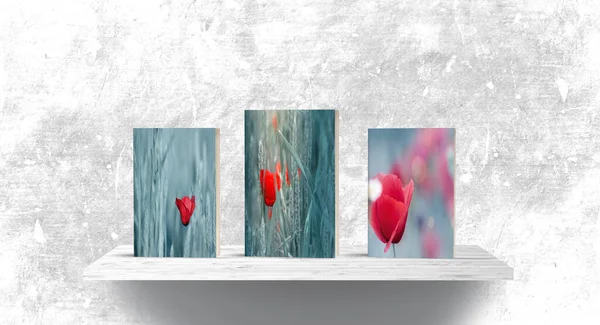 Books on shelf with images of flowers and rustic background.