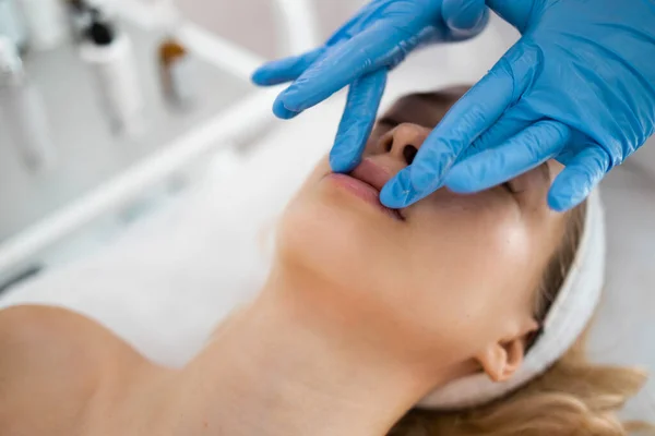 Beautician Massages Lips Young Woman Woman Gets Pleasure Spa Procedures — стоковое фото