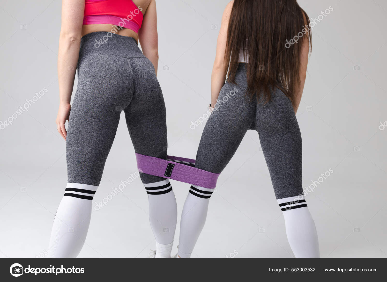 Two Athletic Girls Sexy Leggins Fitness Resistance Band Stock Photo borodai.andrii 553003532