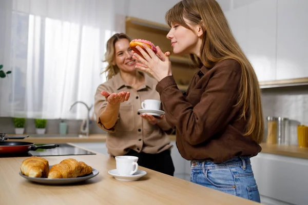 Mature Woman Treats Girl Tasty Donut Coffee Time Kitchen — Stock Photo, Image
