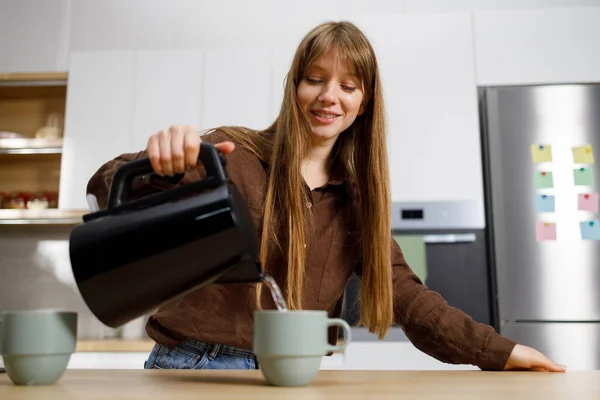 Girl Pours Water Electric Kettle Mug Housewife Making Tea Kitchen — Stock Photo, Image