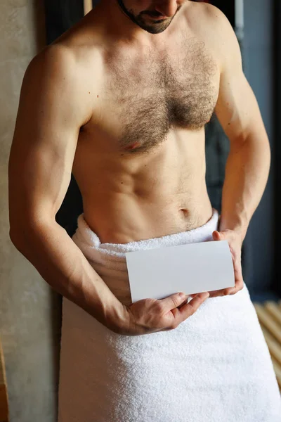 Muscular Man Towel Holding Blank Flyer His Hands Spa Salon — Stock Photo, Image