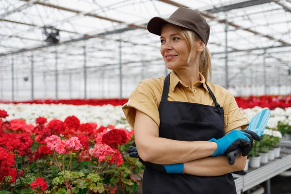 Happy Woman Florist Hand Trowel Greenhouse — Stockfoto