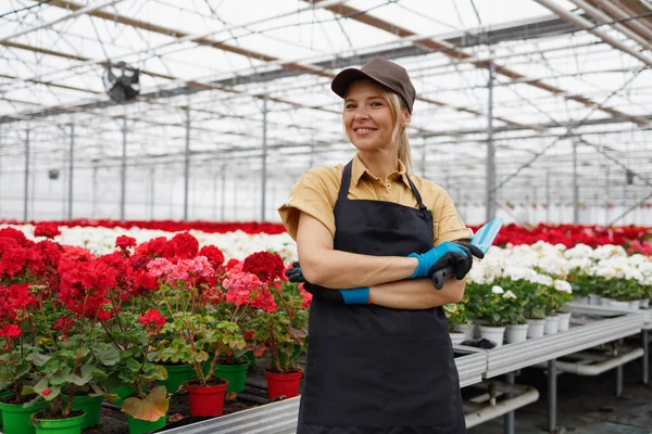 Portrait Cheerful Female Florist Hand Trowel Flower Greenhouse — Stockfoto