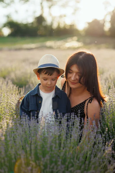 Cute Woman Showing Her Little Son Lavender Field While Walking — Φωτογραφία Αρχείου
