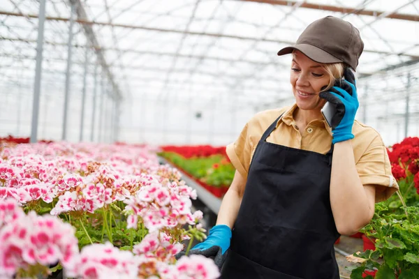 Flower Seller Apron Cap Talking Client Mobile Phone While Standing — Stock Fotó